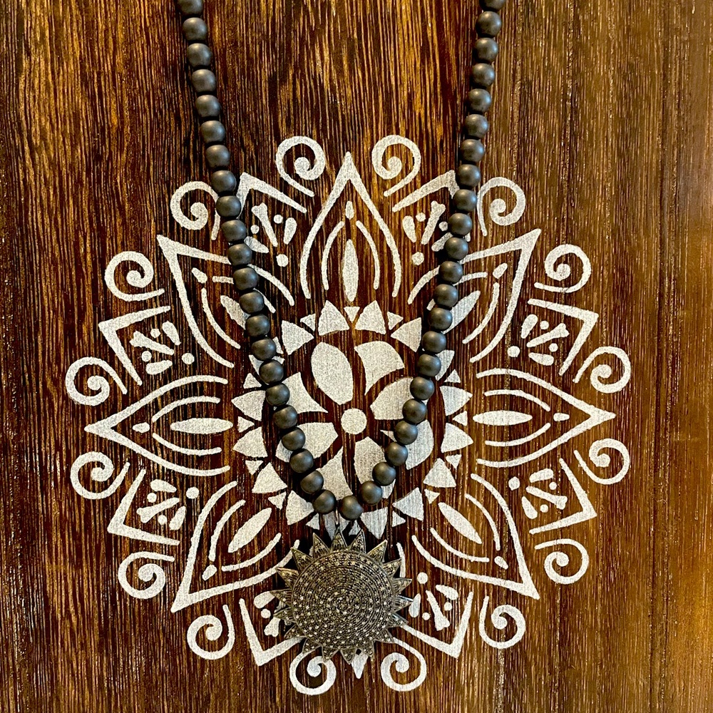 Diamond charm on beads